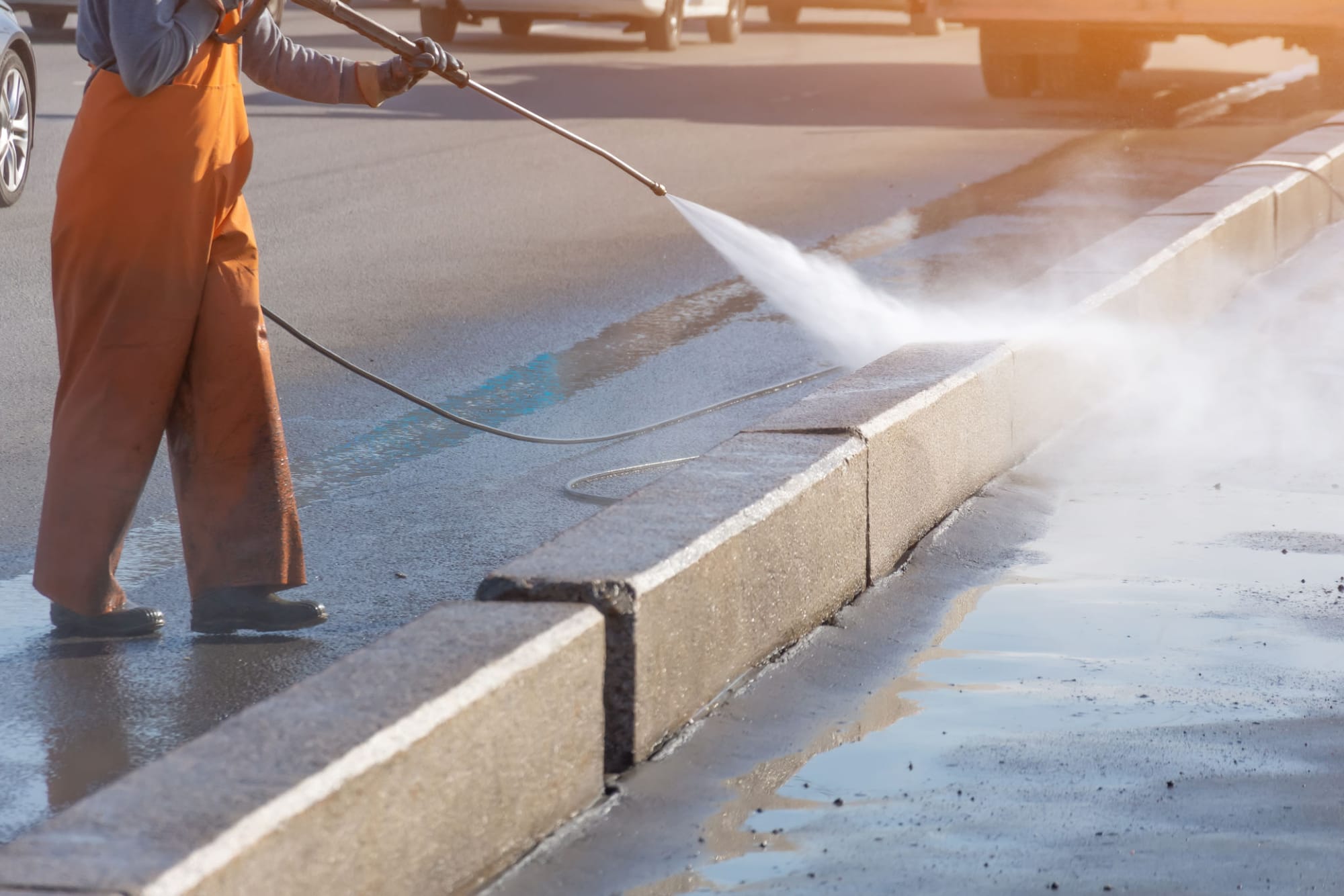 Pressure washing a concrete surface