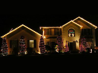 Holiday light installation on a home